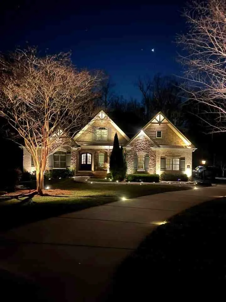 Architectural and landscape lighting on a home at night