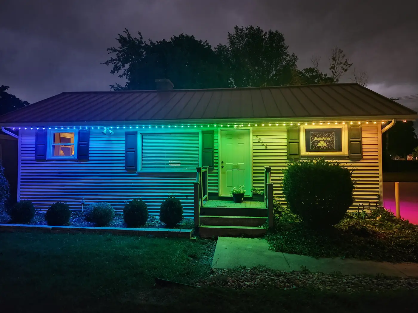 Guenther State Farm with colorful LED lighting - front view